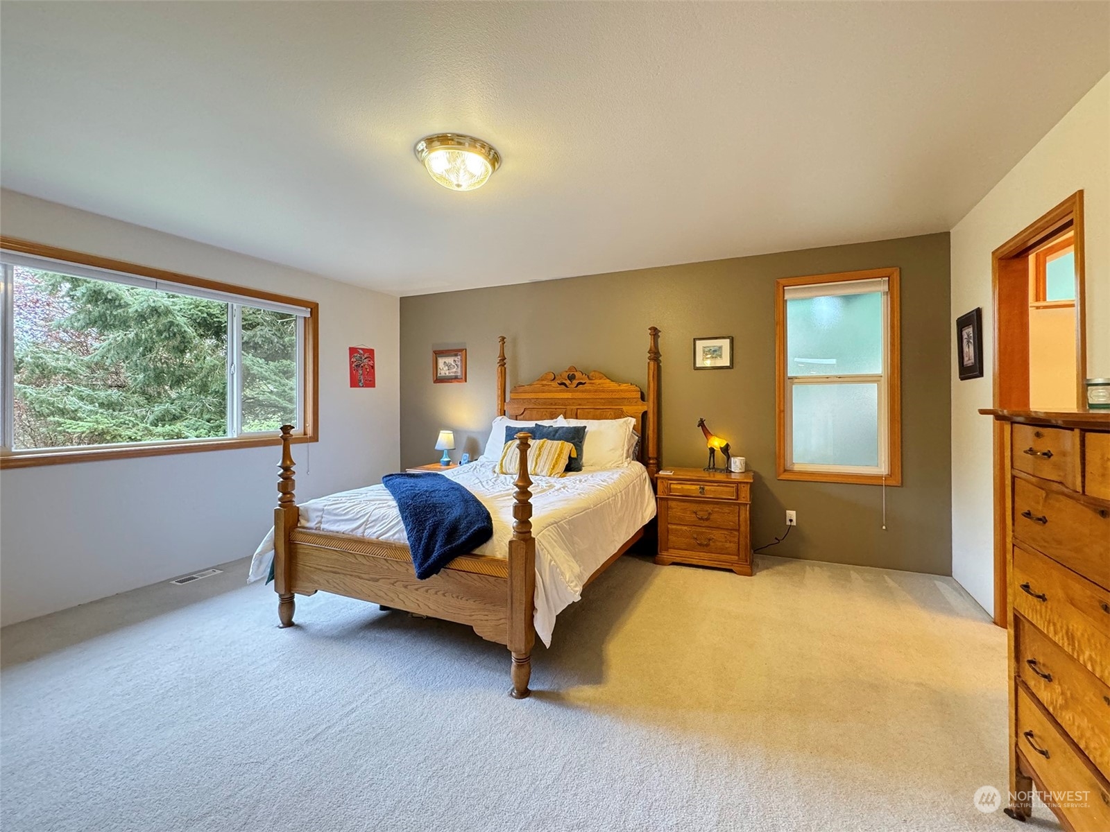 110 Henkes Road Sequim, WA 98382 - Photo 20 of 40 a bed room with a bed and a dresser