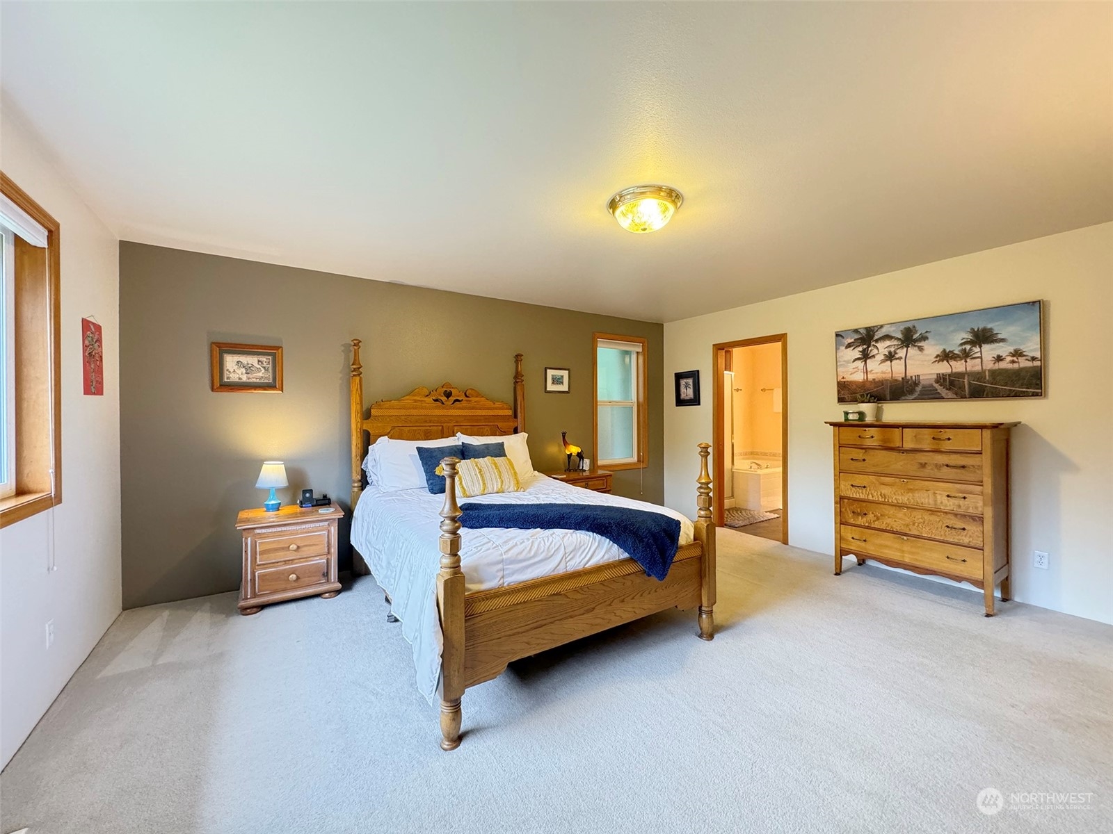 110 Henkes Road Sequim, WA 98382 - Photo 21 of 40 a spacious bedroom with a bed and furniture