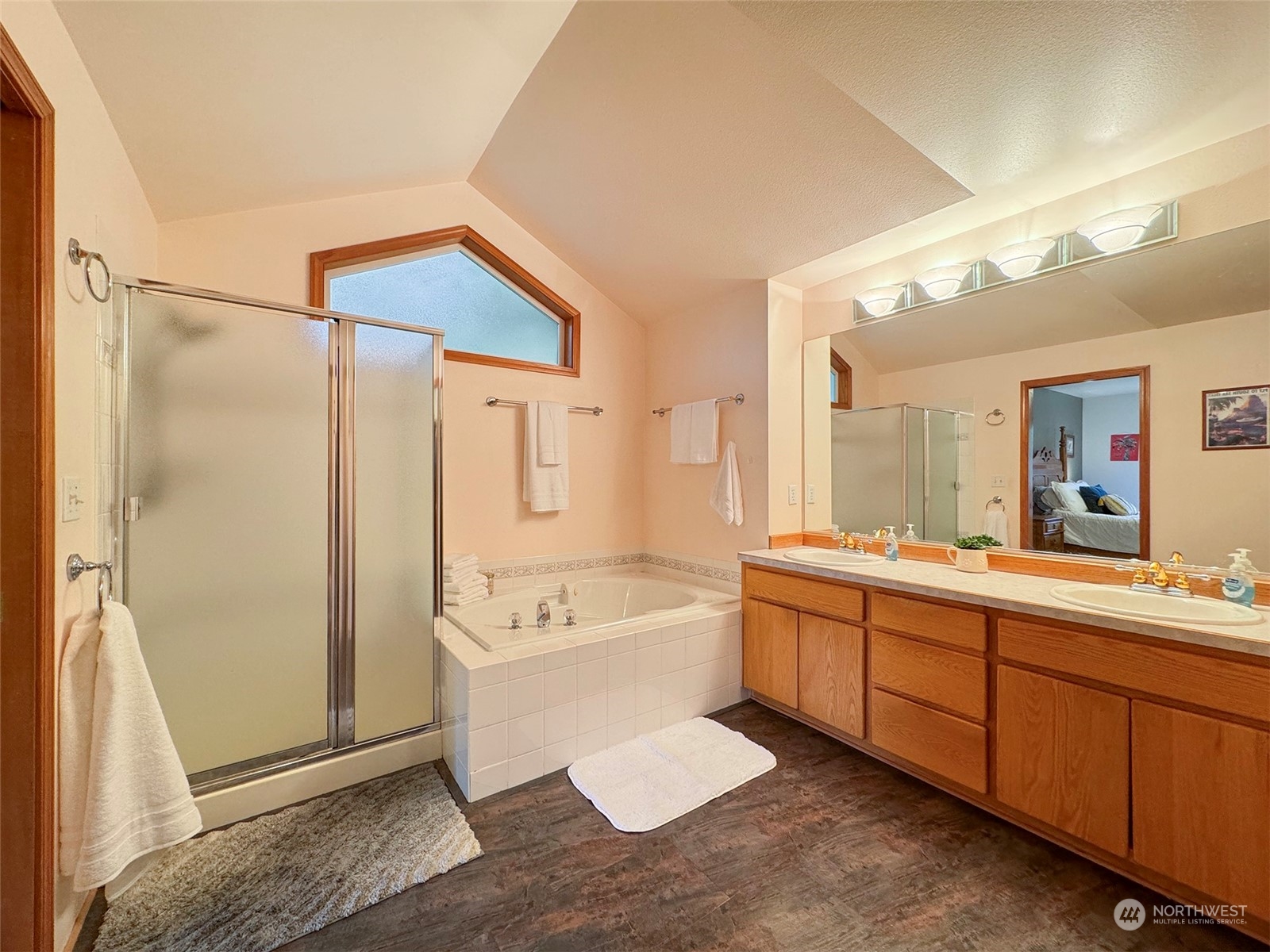 110 Henkes Road Sequim, WA 98382 - Photo 22 of 40 a bathroom with a tub sink shower and mirror