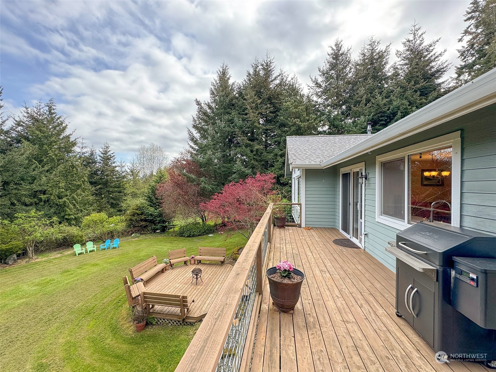 110 Henkes Road Sequim, WA 98382 - Photo 34 of 40 a view of house with backyard space and deck