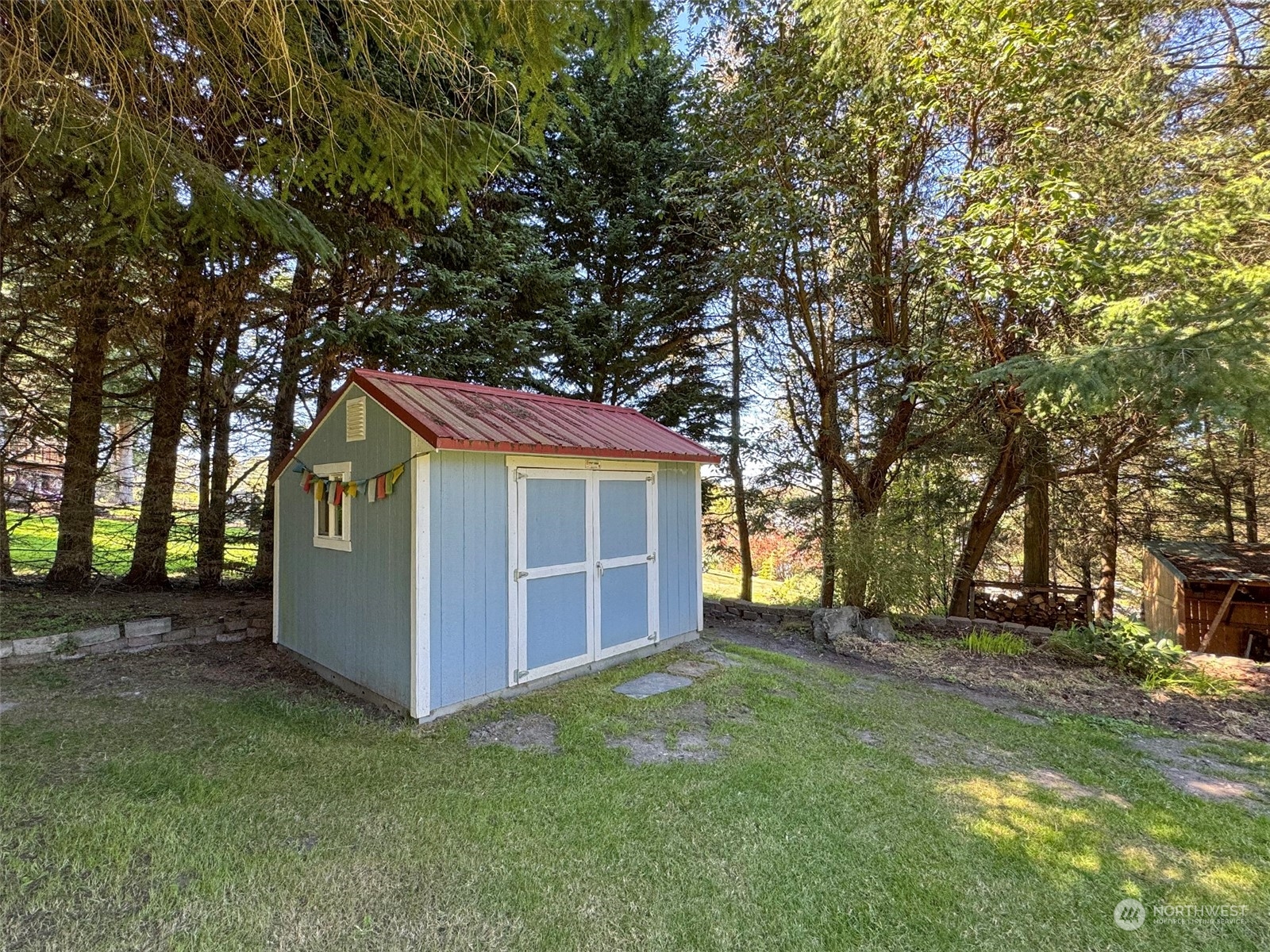 110 Henkes Road Sequim, WA 98382 - Photo 37 of 40 a view of a house with a backyard