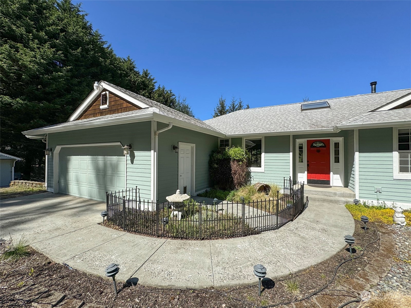 110 Henkes Road Sequim, WA 98382 - Photo 5 of 40 a front view of a house with porch and dining area