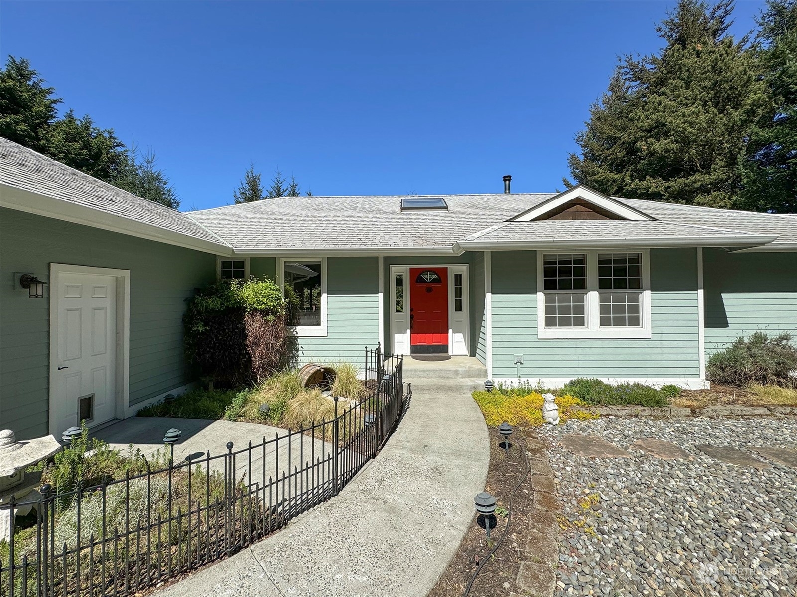 110 Henkes Road Sequim, WA 98382 - Photo 6 of 40 a front view of a house with a porch