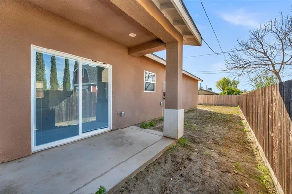 a view of wooden fence of a house