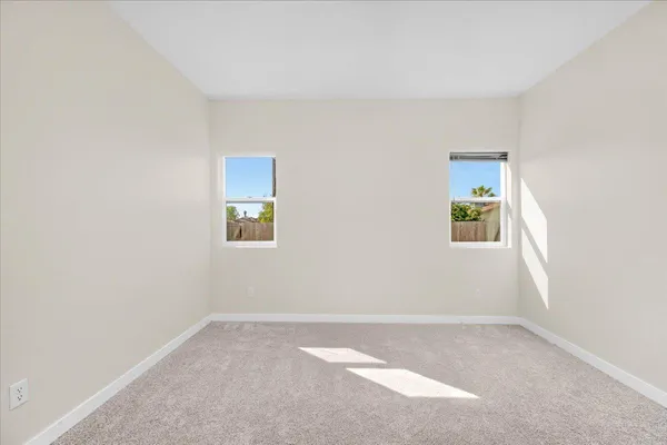 an empty room with windows