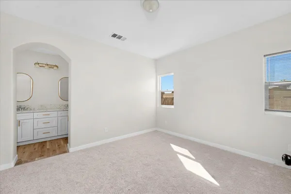 a bathroom with cabinets two sinks and a mirror