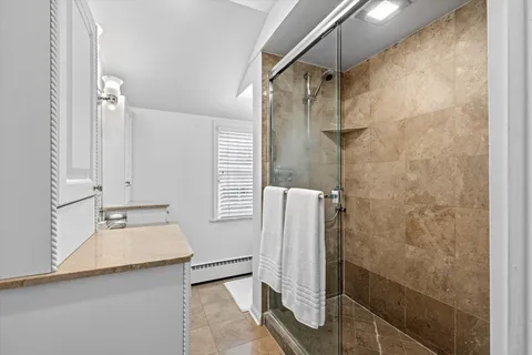 a bathroom with a sink and shower