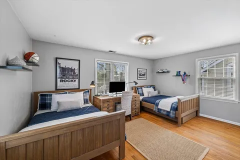 a bedroom with furniture and a window