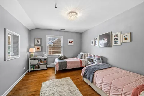 a bedroom with two beds and a couch