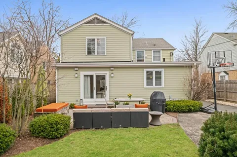a backyard of a house with outdoor seating