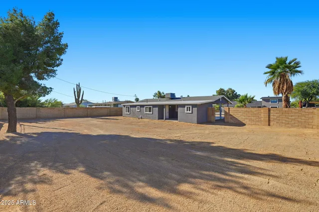 a view of a swimming pool with a yard