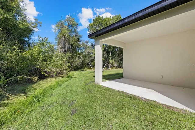 a view of a backyard of the house
