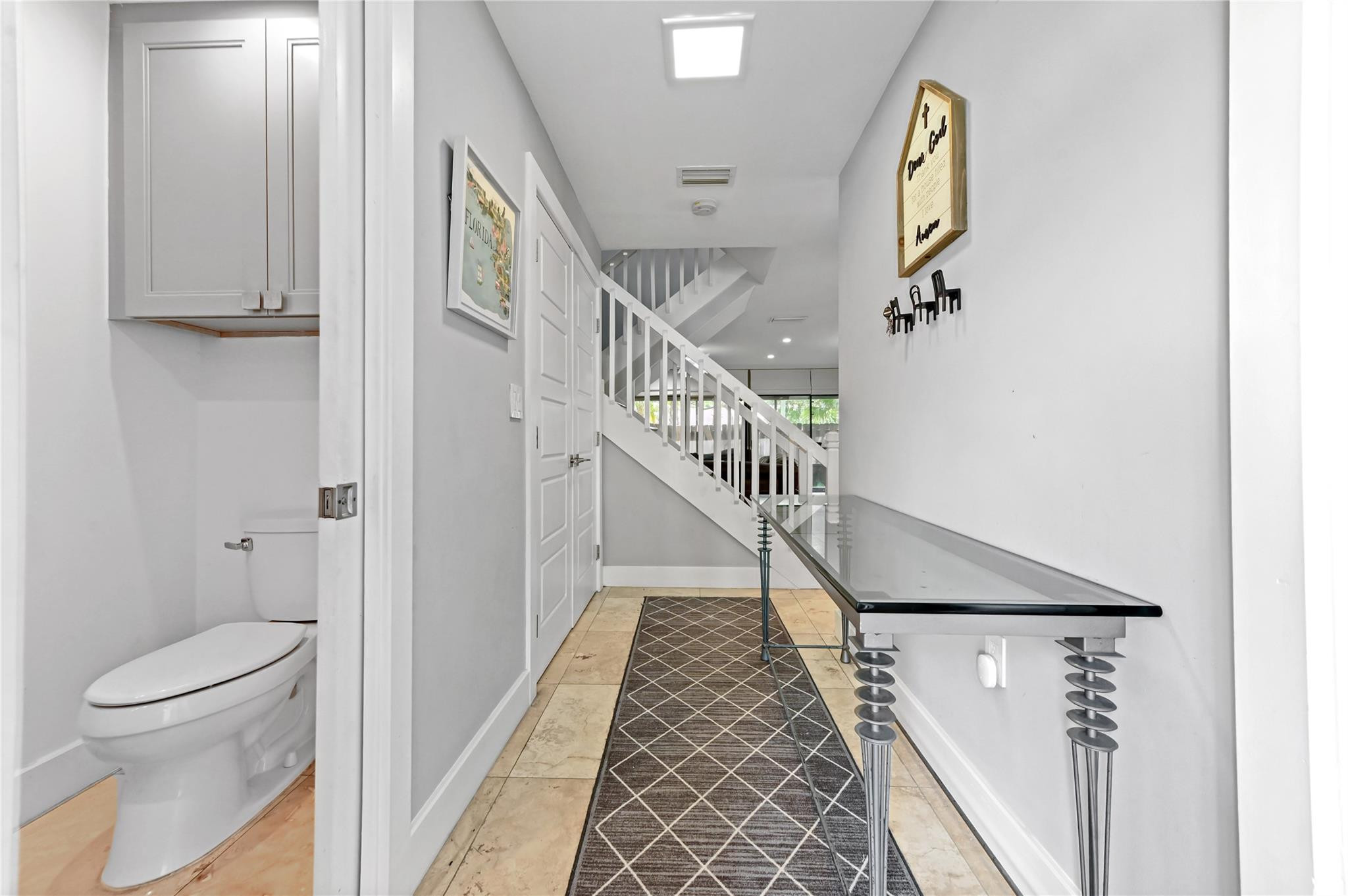 23286 Southwest 54th Way, Unit A Boca Raton, FL 33433 - Photo 8 of 48 front entry hall w half bath
