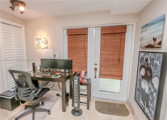 a workspace with furniture and a window