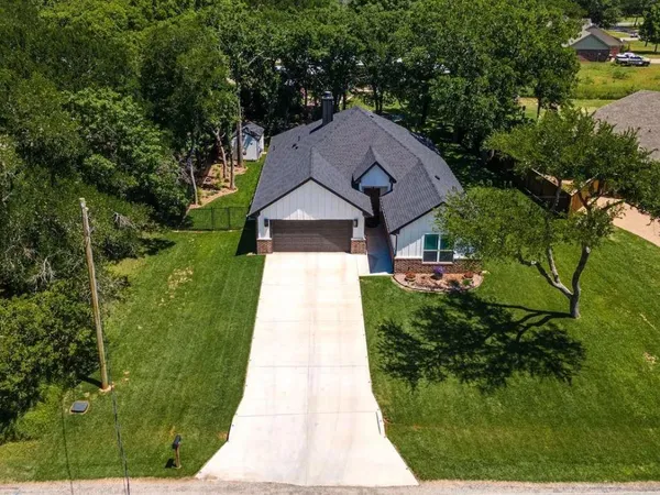 a aerial view of a house with a yard