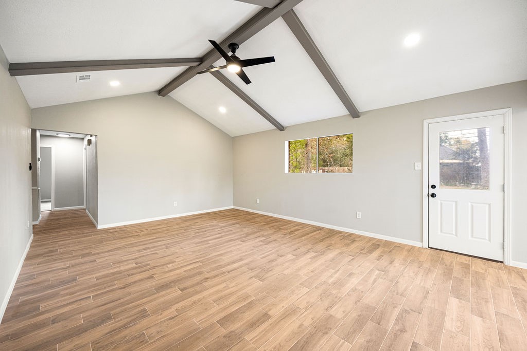 2114 Eagle Point Road Crosby, TX 77532 - Photo 11 of 19 a view of an empty room with wooden floor and a window