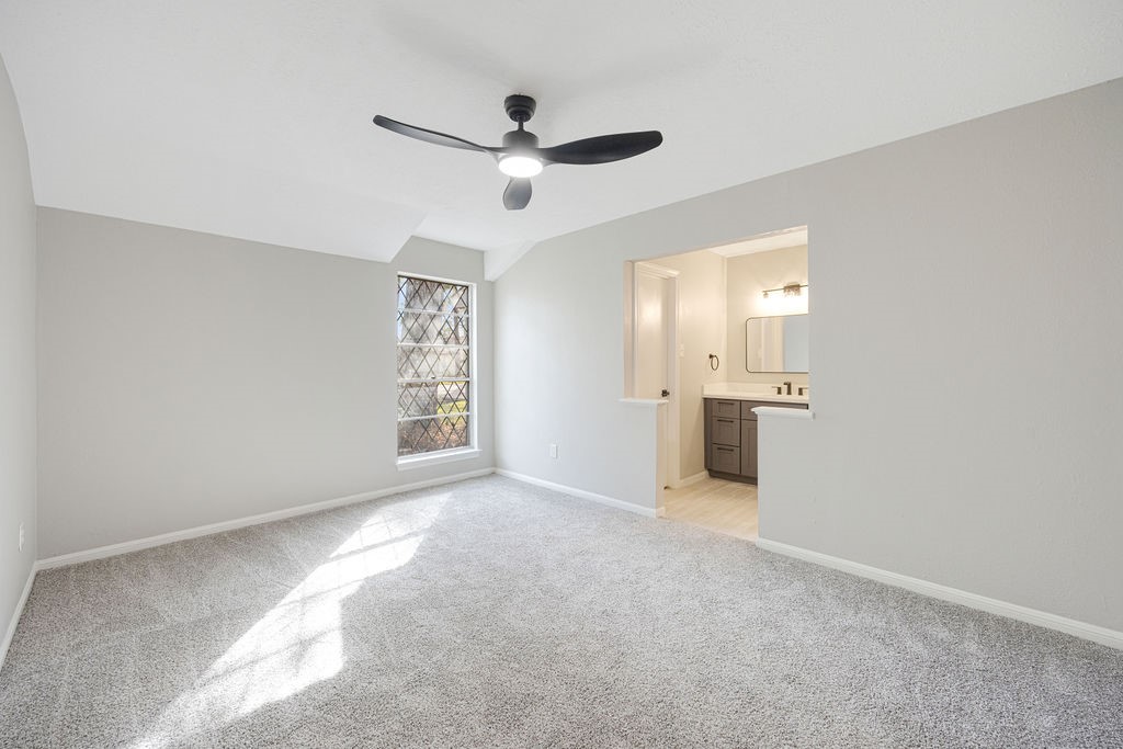 2114 Eagle Point Road Crosby, TX 77532 - Photo 12 of 19 a view of a big room with wooden floor and windows in a room