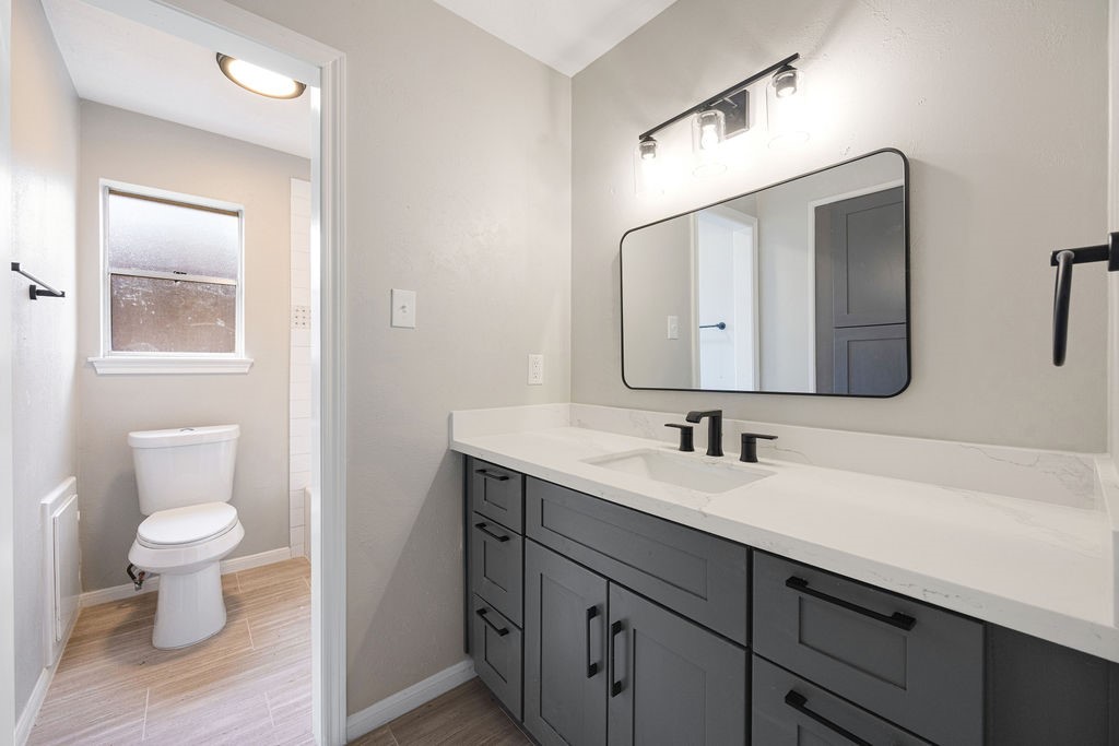 2114 Eagle Point Road Crosby, TX 77532 - Photo 14 of 19 a bathroom with a toilet sink and mirror