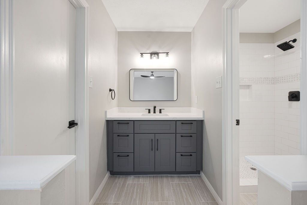 2114 Eagle Point Road Crosby, TX 77532 - Photo 16 of 19 a bathroom with a sink a mirror and shower