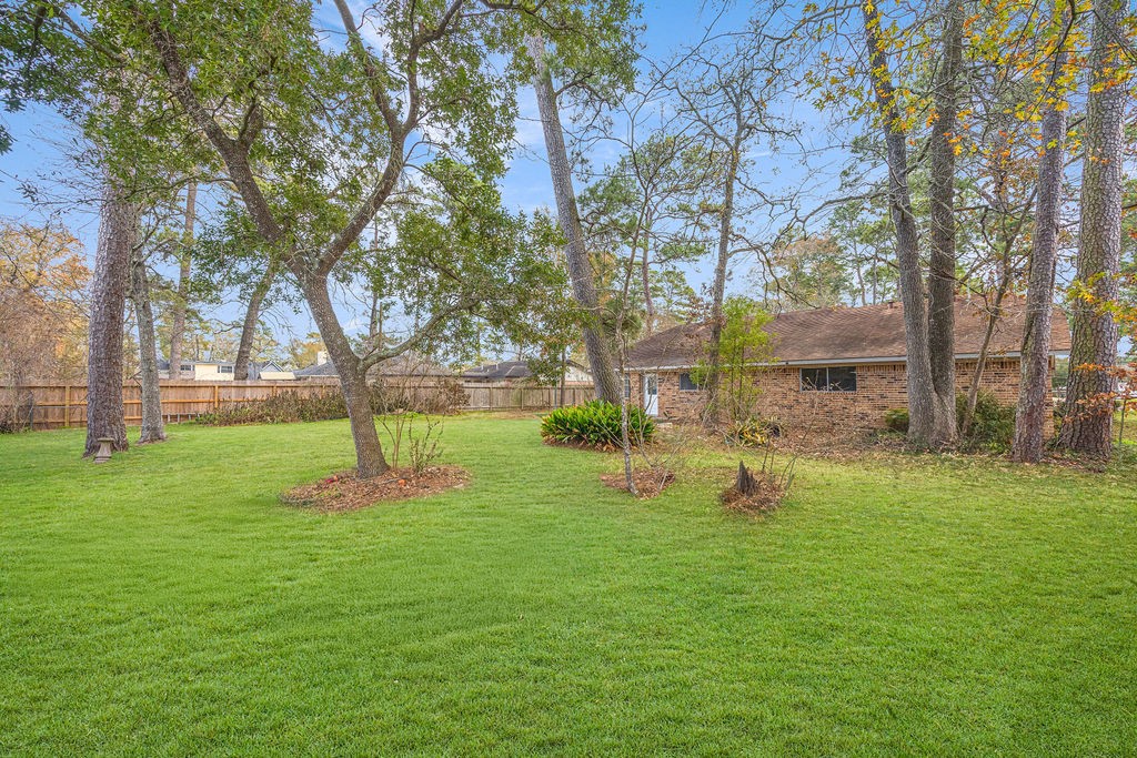 2114 Eagle Point Road Crosby, TX 77532 - Photo 19 of 19 a view of a backyard with large trees