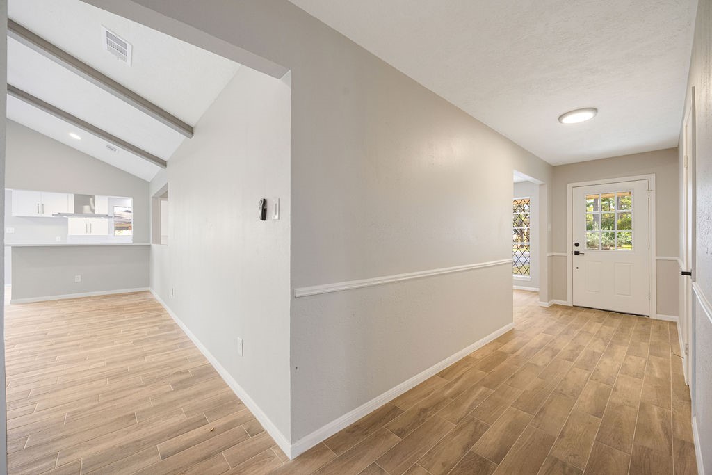 2114 Eagle Point Road Crosby, TX 77532 - Photo 7 of 19 wooden floor in an empty room with a window