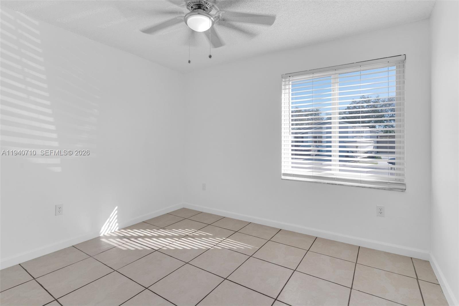 20900 Southwest 118th Avenue Miami, FL 33177 - Photo 11 of 41 a view of an empty room with a window