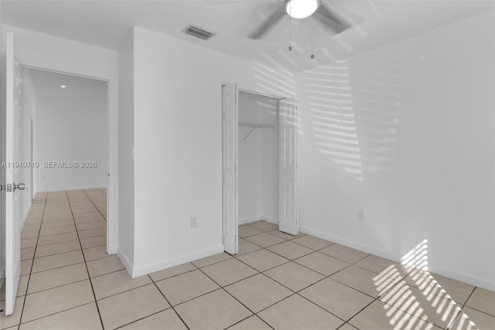 20900 Southwest 118th Avenue Miami, FL 33177 - Photo 12 of 41 a view of an empty room and chandelier fan