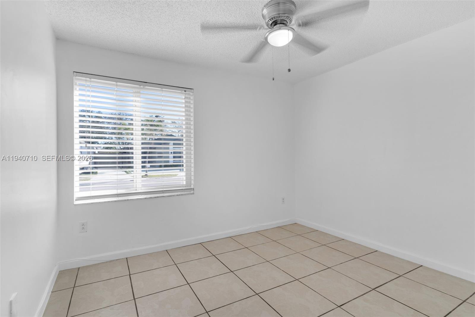 20900 Southwest 118th Avenue Miami, FL 33177 - Photo 15 of 41 a view of an empty room with a window