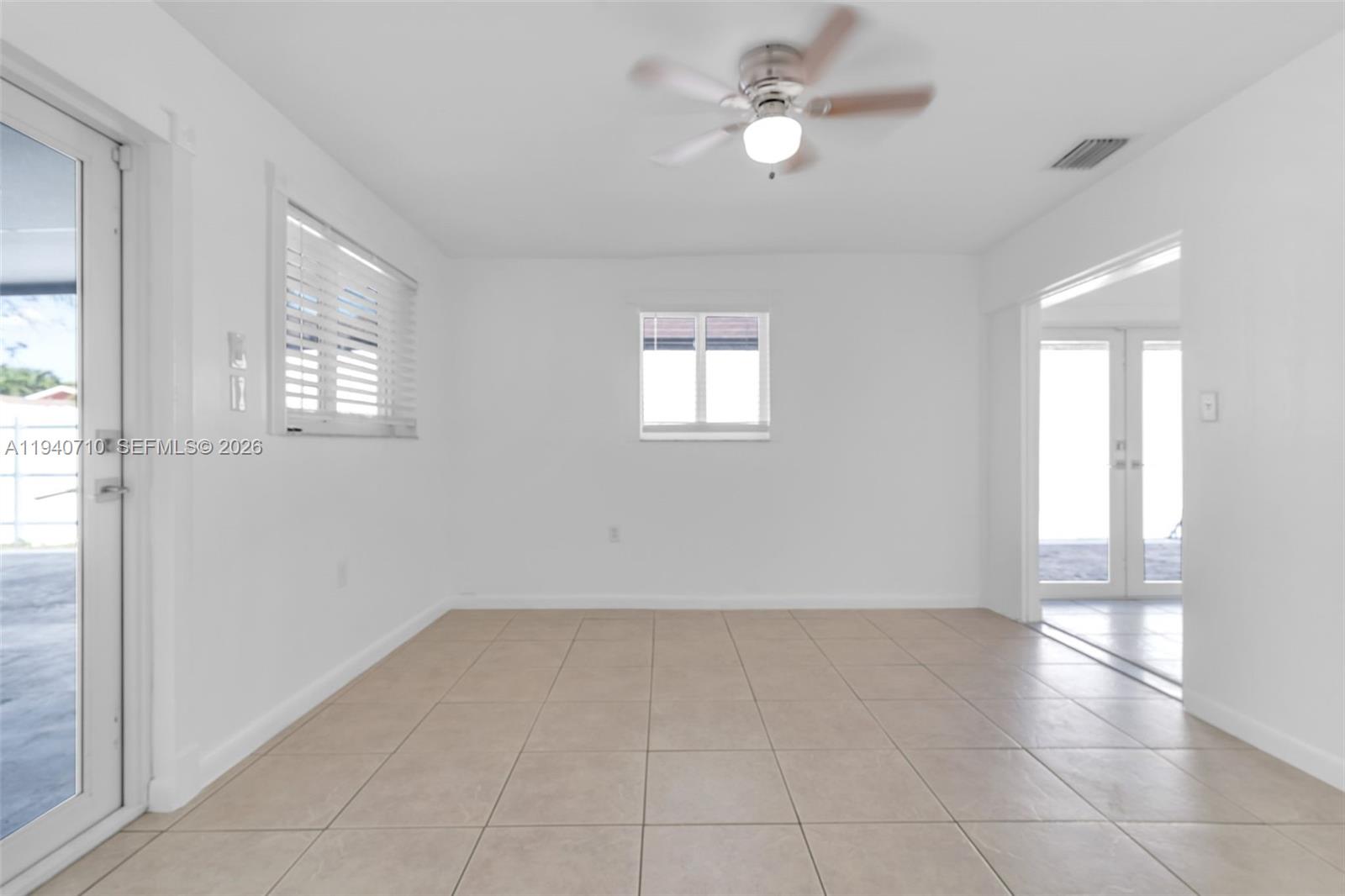 20900 Southwest 118th Avenue Miami, FL 33177 - Photo 23 of 41 a view of an empty room with a window