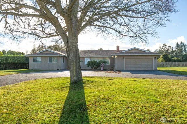a front view of house with yard and swimming pool