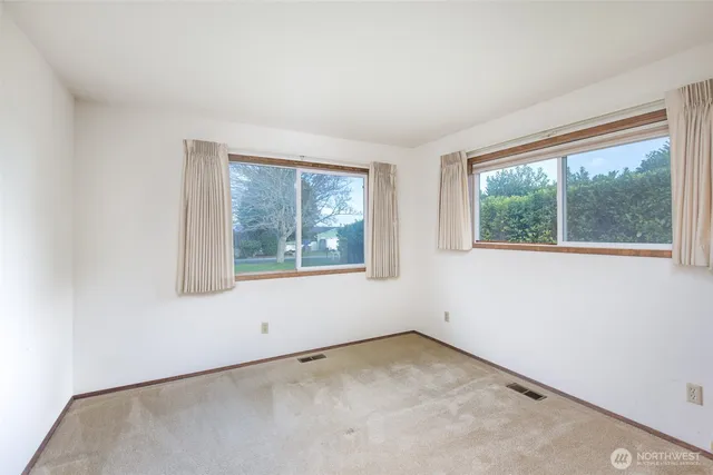 a view of a hallway with a large window