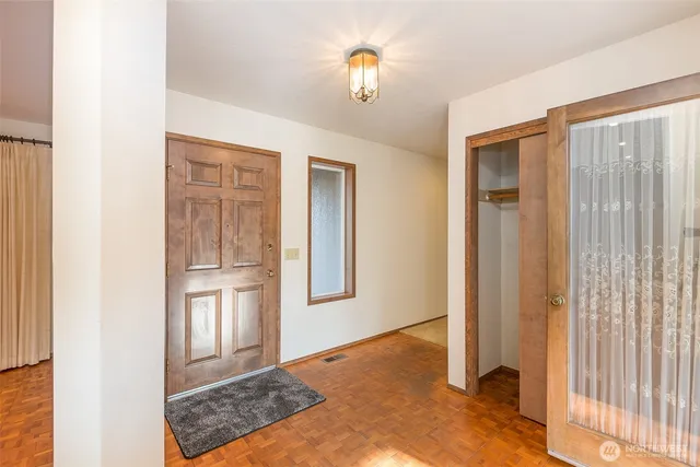 a view of livingroom with hardwood floor and cabinet