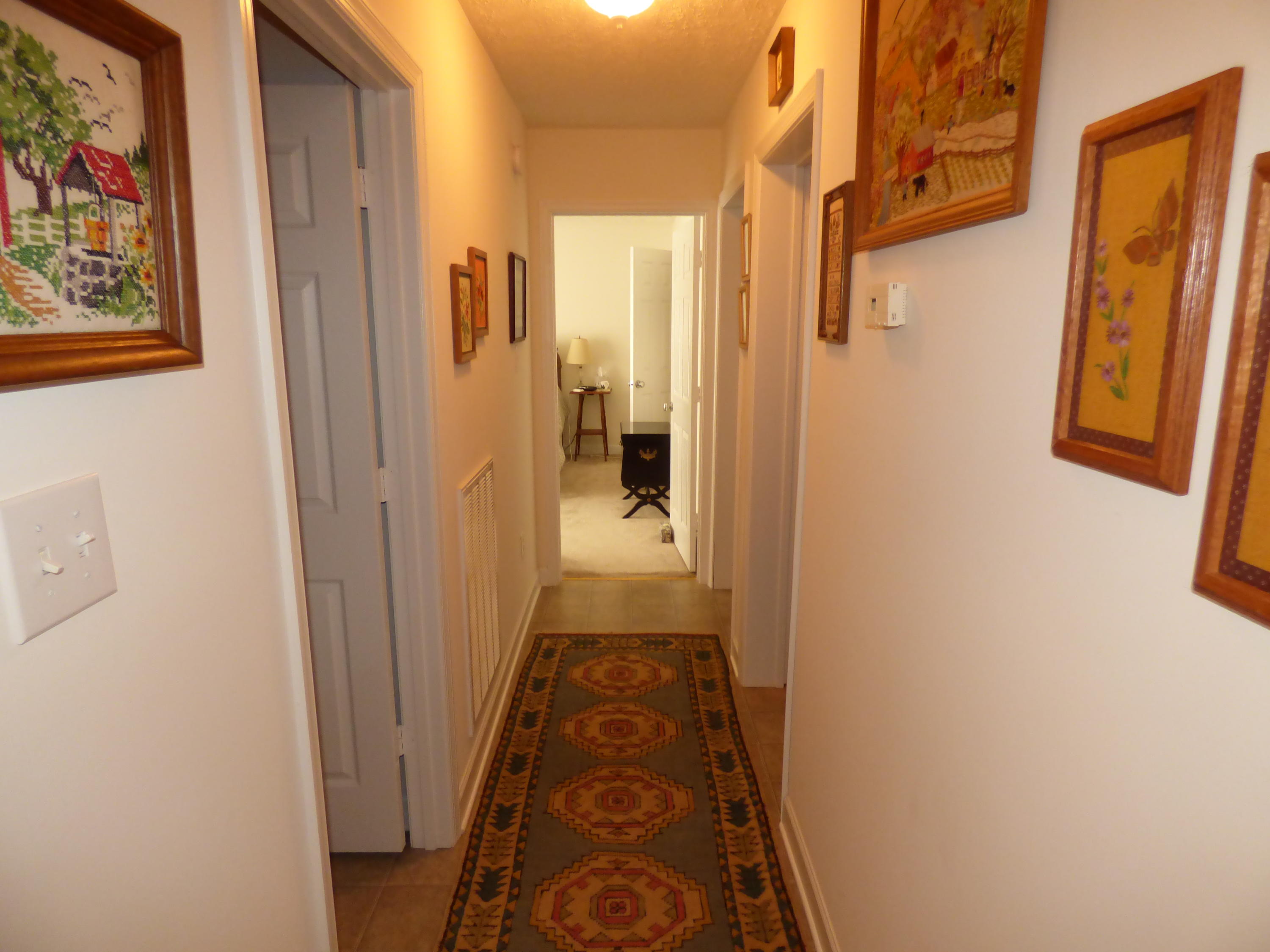 435 Endicott Hill Road Ferrum, VA 24088 - Photo 16 of 22 a view of a hallway view with wooden floor and a bathroom