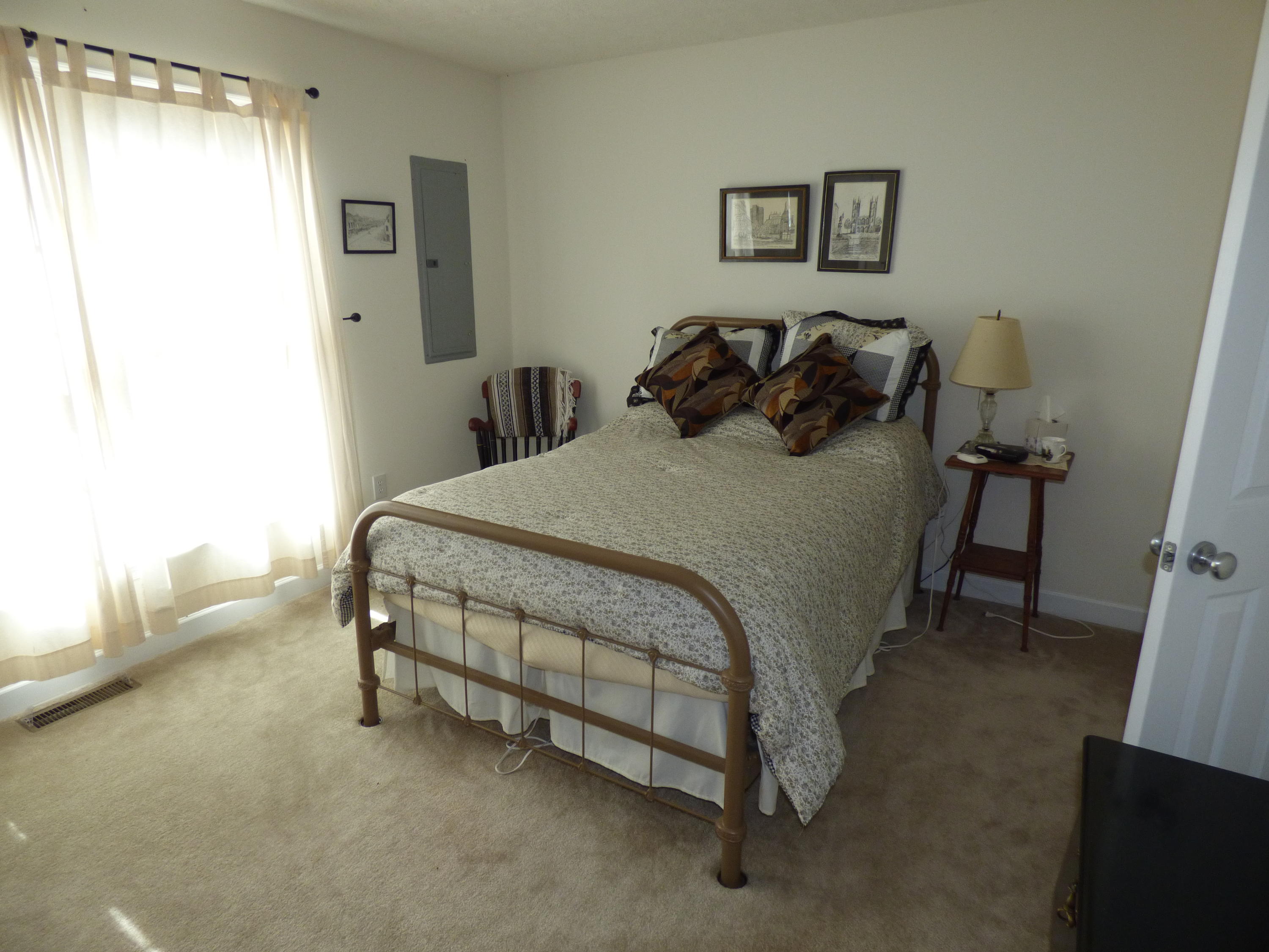 435 Endicott Hill Road Ferrum, VA 24088 - Photo 21 of 22 a bedroom with a bed and a table in it