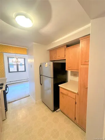 a large kitchen with a sink and cabinets