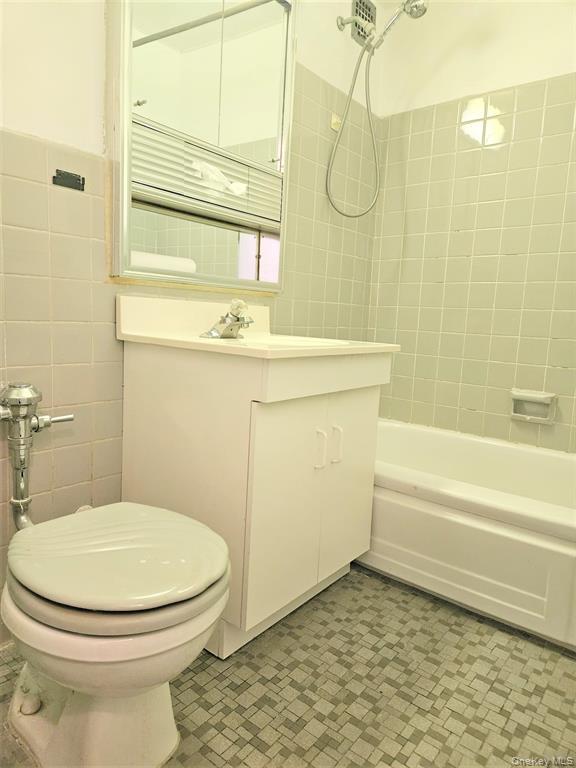 99-06 58th Avenue, Unit 3H Queens, NY 11368 - Photo 19 of 23 a bathroom with a toilet and a shower