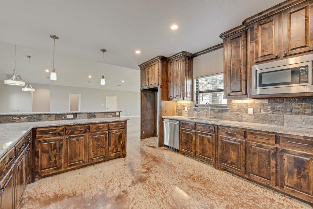 461 Pearson Ranch Road Azle, TX 76020 - Photo 17 of 40 Spacious kitchen with double ovens and a huge walk-in pantry.