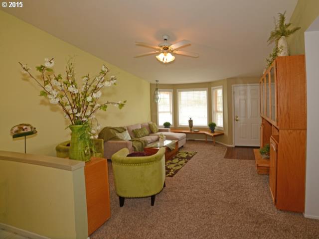 3504 E Street Springfield, OR 97478 - Photo 3 of 16 a living room with furniture and a chandelier