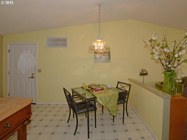 3504 E Street Springfield, OR 97478 - Photo 4 of 16 a view of a dining room with furniture and chandelier