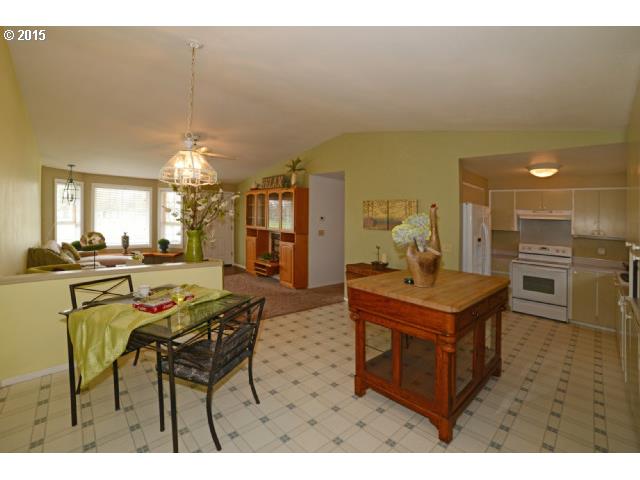 3504 E Street Springfield, OR 97478 - Photo 5 of 16 a view of a dining room with furniture and a chandelier
