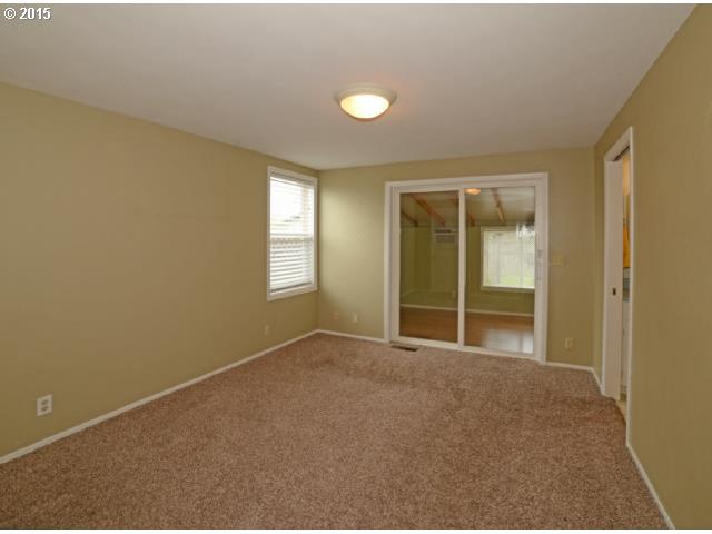 3504 E Street Springfield, OR 97478 - Photo 8 of 16 an empty room with windows and closet