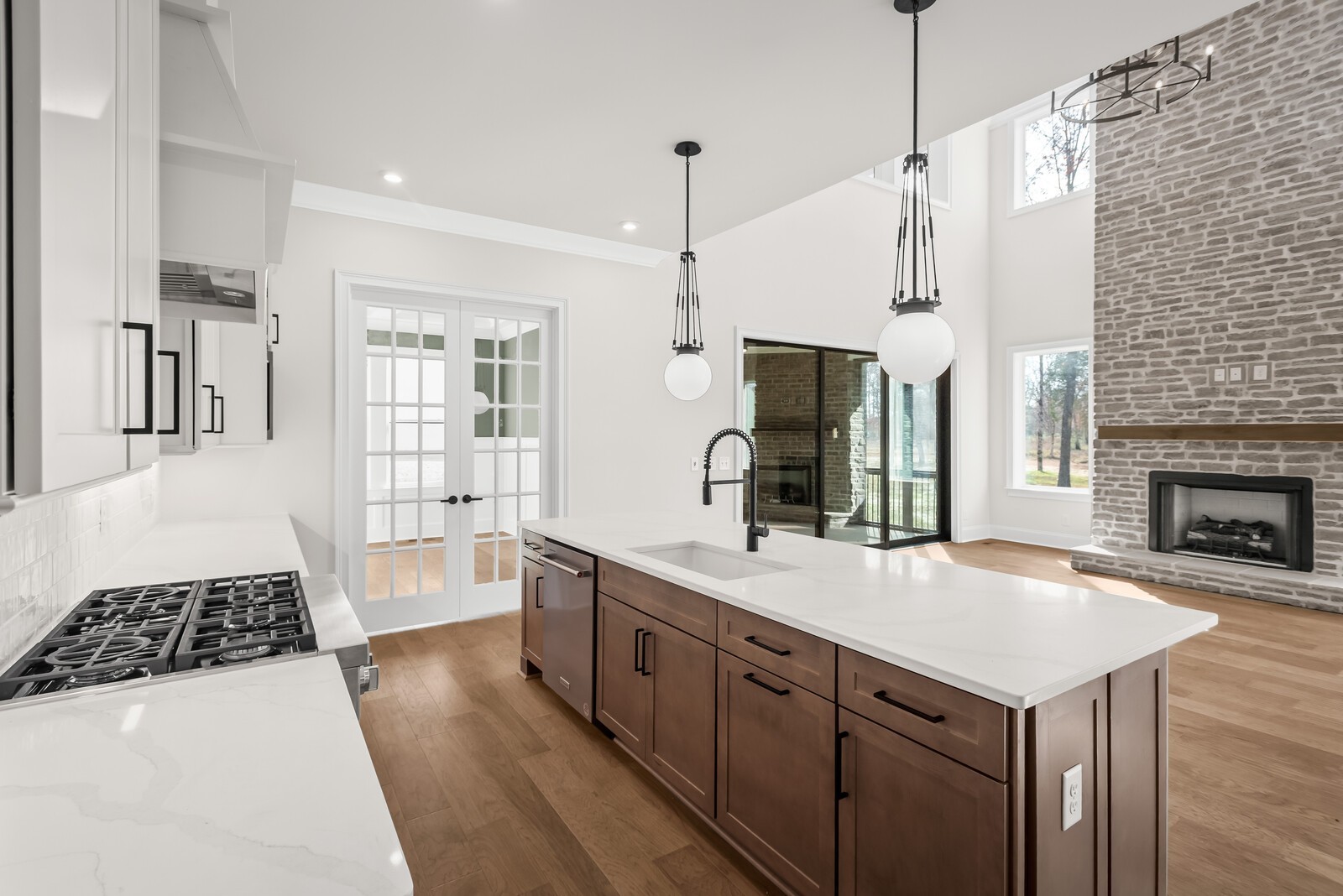 7221 Severide Street Fairview, TN 37062 - Photo 25 of 59 a kitchen with a sink a stove and a wooden floor