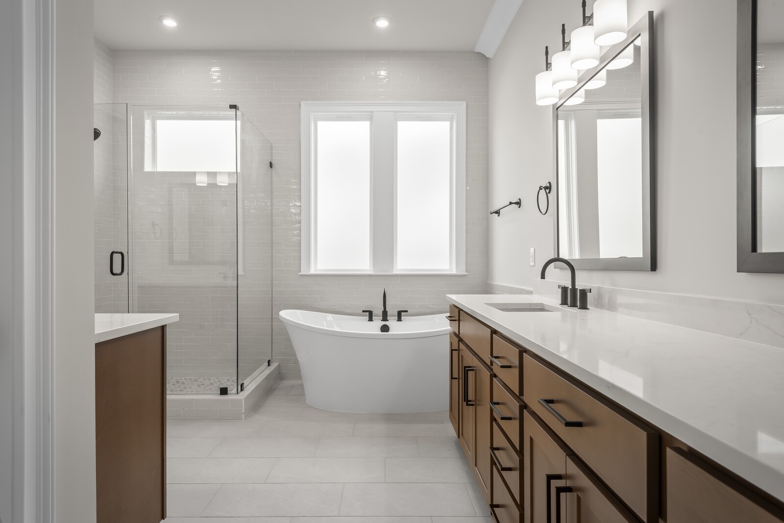 7221 Severide Street Fairview, TN 37062 - Photo 30 of 59 a bathroom with a double vanity sink a mirror and a bathtub