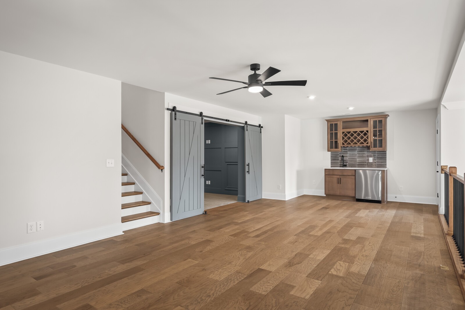 7221 Severide Street Fairview, TN 37062 - Photo 39 of 59 a view of a livingroom with wooden floor and ceiling fan