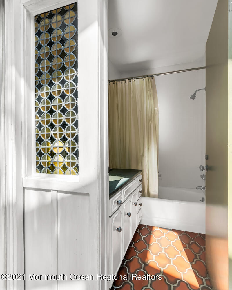 136 Rumson Road Rumson, NJ 07760 - Photo 13 of 26 a bathroom with a bathtub and a shower