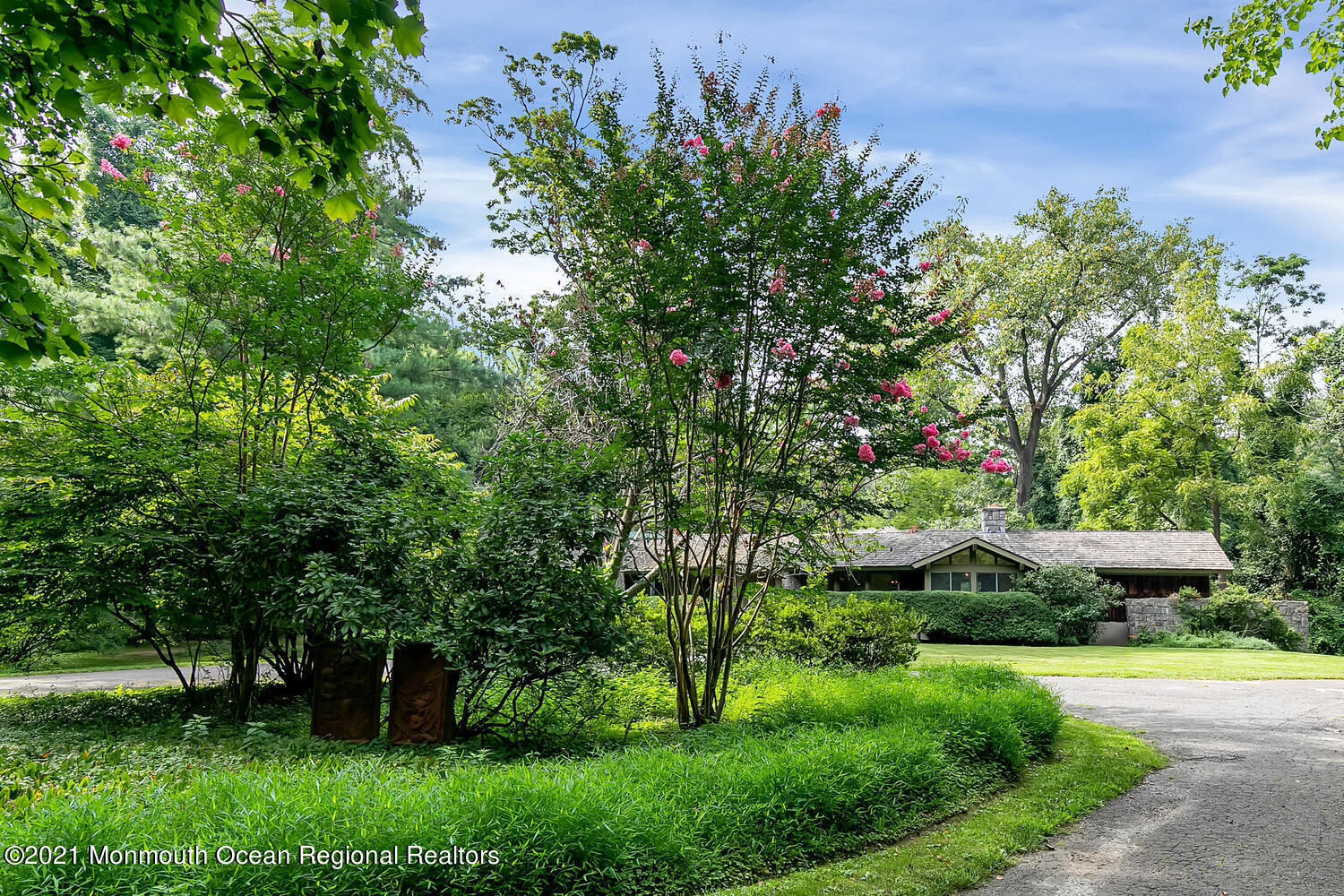 136 Rumson Road Rumson, NJ 07760 - Photo 3 of 26 a view of a garden with plants and large trees