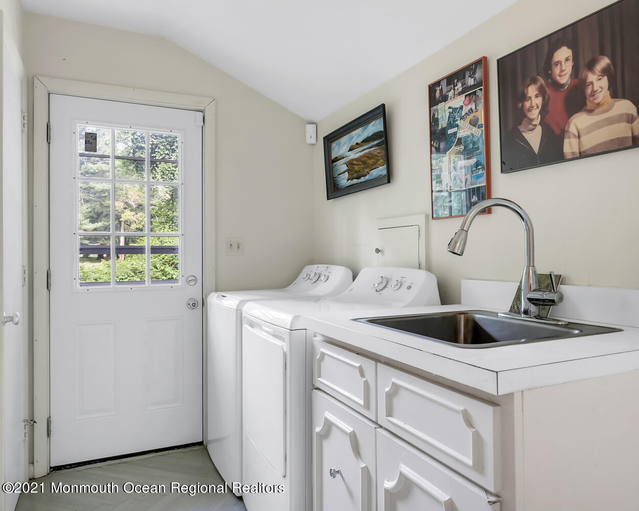 136 Rumson Road Rumson, NJ 07760 - Photo 22 of 26 a view of a kitchen that has a sink and a stove with wooden floor