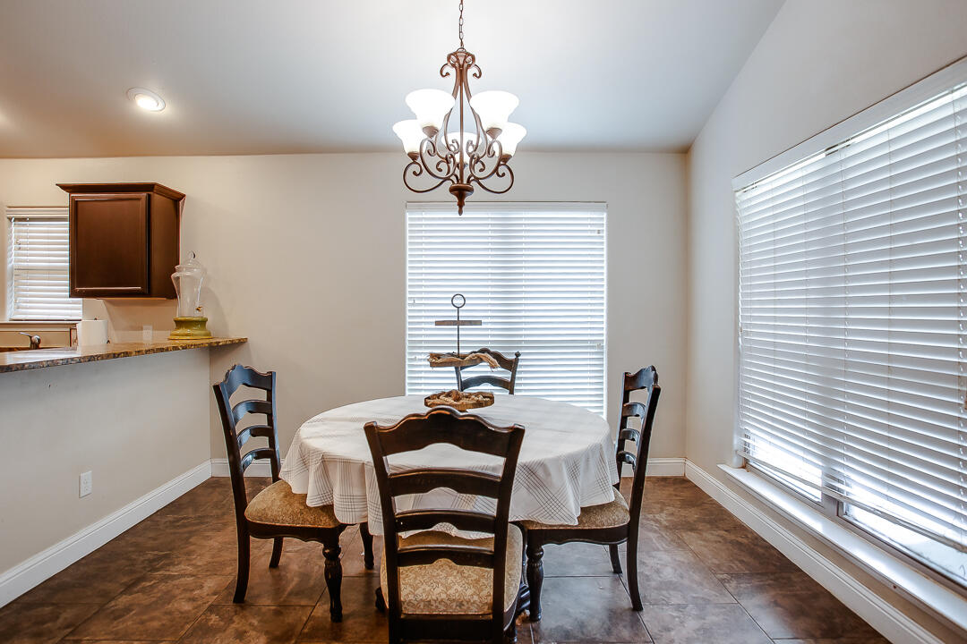 8804 Rochester Avenue Lubbock, TX 79424 - Photo 5 of 18 a dining room with furniture and window