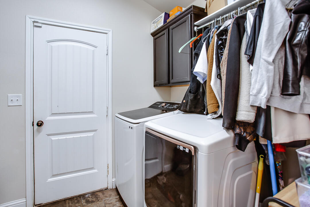 8804 Rochester Avenue Lubbock, TX 79424 - Photo 10 of 18 a view of walk in closet with clothes and shoes