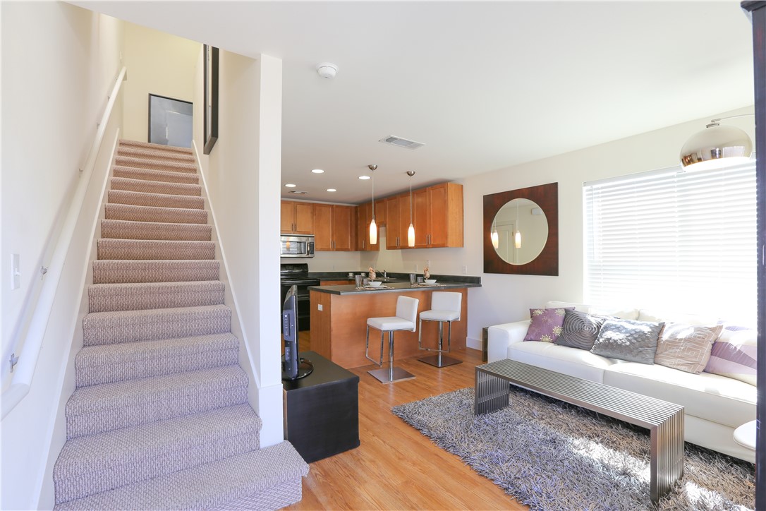 a living room with furniture and a mirror